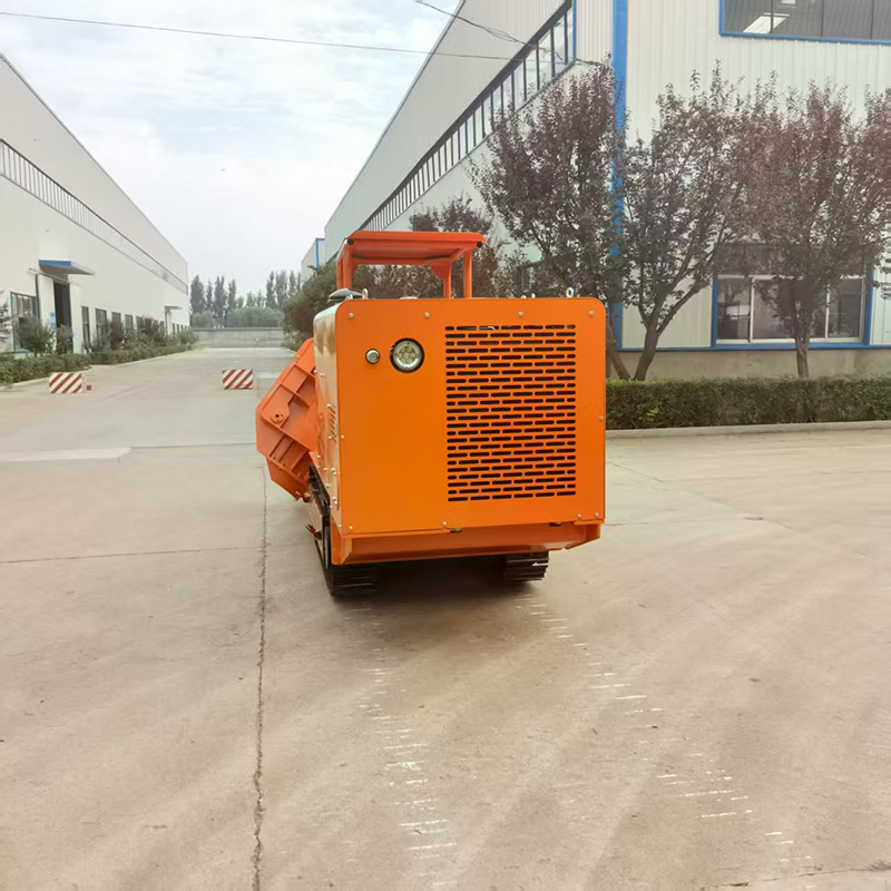 Carregador de rochas com descarga lateral de 100